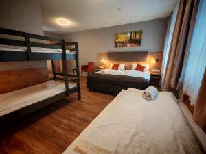 Postel nebo postele na pokoji v ubytování Hotel La Mirabelle close to Europa Park