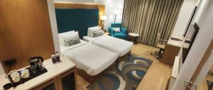 Best Western Plus Chandigarh Mohali客房内的一张或多张床位