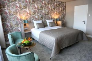 Postel nebo postele na pokoji v ubytování Van der Valk Hotel Avifauna