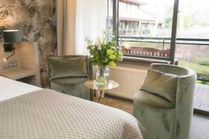 Postel nebo postele na pokoji v ubytování Van der Valk Hotel Avifauna