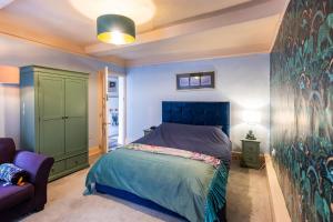 Кровать или кровати в номере Maverick Rooms +6 фотографий