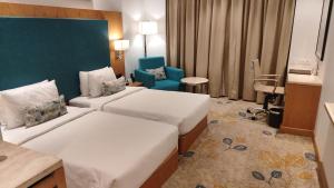 Best Western Plus Chandigarh Mohali客房内的一张或多张床位