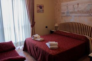 Postel nebo postele na pokoji v ubytování Hotel Sicilia