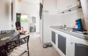 a kitchen with a sink and a counter top at Lovely Home In Peri With Wifi in Peri