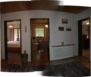 a room with a bedroom with a bed and a living room at Haus Auzinger in Schönau am Königssee +1 photo