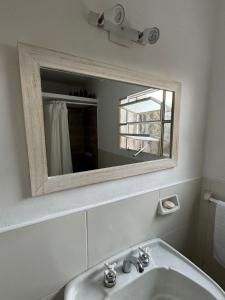 a bathroom with a sink and a mirror at Departamento en junin in Junín