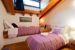 En eller flere senge i et værelse på Stella Marina 2