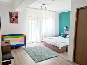 Postel nebo postele na pokoji v ubytování Vila David 2 Comarnic