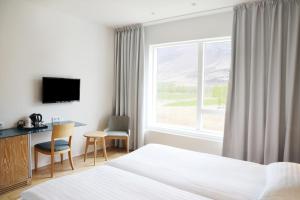 Postel nebo postele na pokoji v ubytování Fosshotel Vatnajökull + 37 fotografií