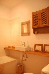a bathroom with a sink and a toilet at Casa rural Olivar de Albarizas in Fernancaballero +26 photos