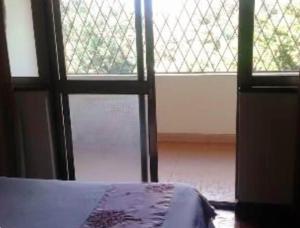 Ένα ή περισσότερα κρεβάτια σε δωμάτιο στο Honeycourt