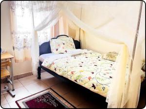 Ένα ή περισσότερα κρεβάτια σε δωμάτιο στο NIA Home - 2 Bedroom, 2 Baths Affordable, Spacious & Budget Friendly Apartment