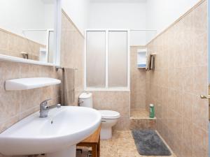 a bathroom with a sink and a toilet at Live Playa Alcalá in Alcalá +21 photos