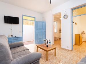 a living room with a couch and a table at Live Playa Alcalá in Alcalá