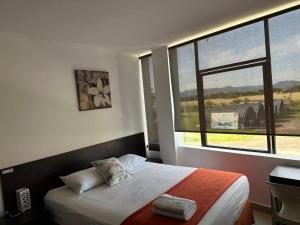 Postel nebo postele na pokoji v ubytování Hotel Punta Azul