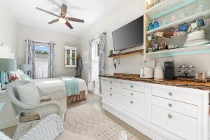 a bedroom with a bed and a ceiling fan at The 1885 Suites in Picton