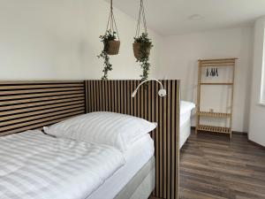 Postel nebo postele na pokoji v ubytování City Apartments Bludenz