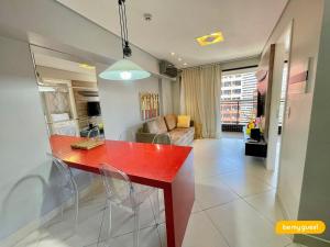 a kitchen with a red counter top in a room at Landscape melhores apartamentos da Beira Mar in Fortaleza
