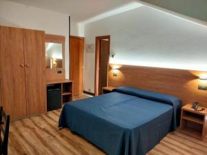 Postel nebo postele na pokoji v ubytování Hotel Tripoli La Margherita