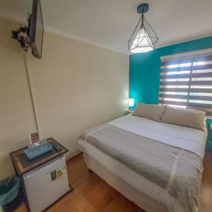 Cama ou camas em um quarto em Hostal Terraza Recreo