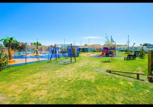 a park with a playground with a play area at MP676 Parkdean Camber Sands in Camber