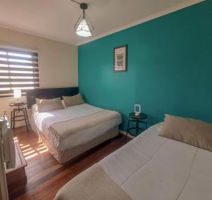 Cama ou camas em um quarto em Hostal Terraza Recreo