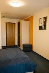 Posteľ alebo postele v izbe v ubytovaní 7 Days Hotel Kamyanets-Podilskyi
