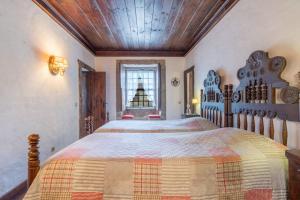Ένα ή περισσότερα κρεβάτια σε δωμάτιο στο Casa Dom Mendo
