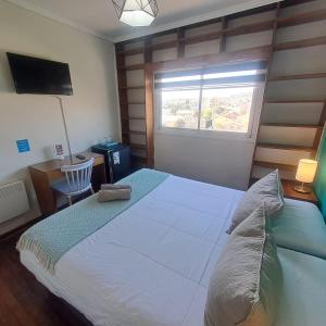 Cama ou camas em um quarto em Hostal Terraza Recreo