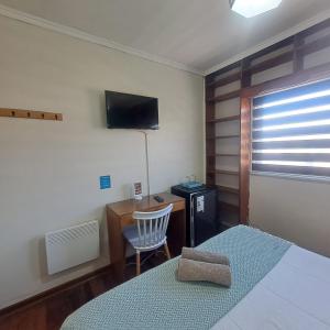 Cama ou camas em um quarto em Hostal Terraza Recreo
