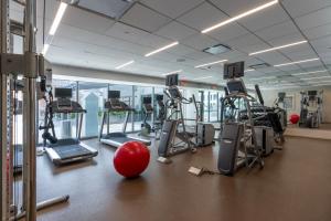 a gym with tread machines and a red ball on the floor at Holiday Inn New Orleans-Downtown Superdome by IHG in New Orleans +83 photos