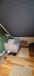 a living room with a couch and a table at Øya husrom 2 in Sarpsborg