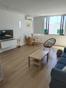 a living room with a couch and a table at Casa Valentina in Tías