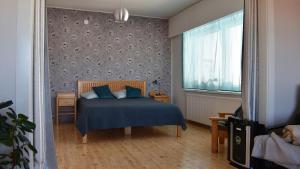 Postel nebo postele na pokoji v ubytování Kouvola Apartment + 25 fotografií