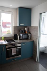 Kuchyň nebo kuchyňský kout v ubytování hochwertiges Studio in bester Lage