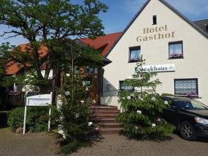 a building with two christmas trees in front of it at Hotel Schwarze in Bremen