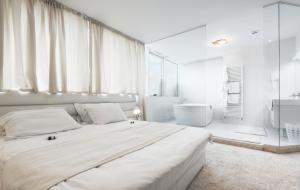 Postel nebo postele na pokoji v ubytování Hotel Arka