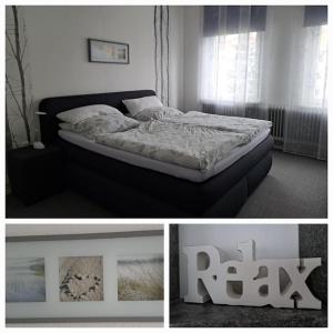 a bedroom with a bed in a room with a window at Ferienwohnung mitten in der City in Wilhelmshaven