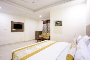 Postel nebo postele na pokoji v ubytování Hotel Happy Stay Delhi Airport