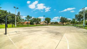 an empty basketball court in a park at 7671 Comrow Unit 205 in Kissimmee