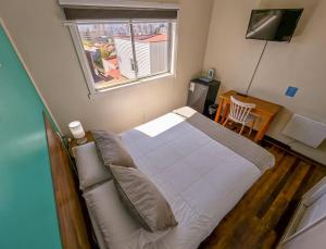 Uma TV ou centro de entretenimento em Hostal Terraza Recreo