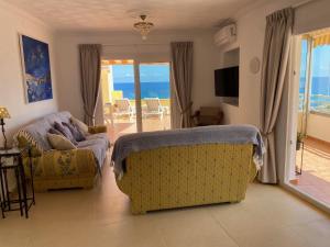 a living room with a view of the ocean at 29D Vistas espectaculares parking and wifi in Calpe