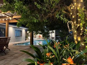 a backyard with a swimming pool and some plants at Tehillah on Boom in Bothasig