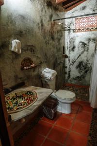 a dirty bathroom with a toilet and a shower at Jorullo Paradise in Puerto Vallarta +41 photos