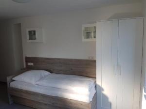Postel nebo postele na pokoji v ubytování hochwertiges Studio in bester Lage