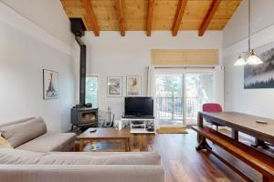 a living room with a couch and a table at 2 Bed 2 Bath Apartment in Carnelian Bay in Carnelian Bay