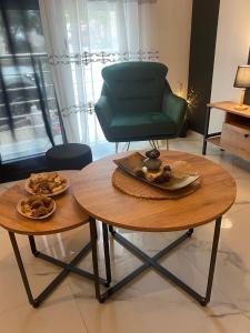 a green chair and a table in a room at Arletos Home in Ioannina +33 photos