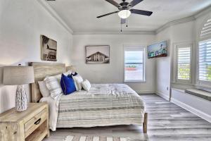 a bedroom with a bed and a ceiling fan at Villa At Bahia Shores-Whole Property in St Pete Beach +42 photos