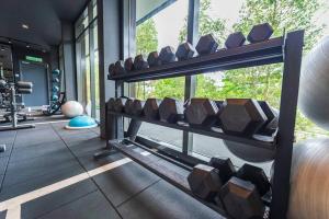 a room with a bunch of shelves in a gym at Emerald Hill Kuala Lumpur by HLG in Kuala Lumpur