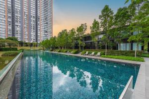 a large swimming pool in a city with tall buildings at Emerald Hill Kuala Lumpur by HLG in Kuala Lumpur